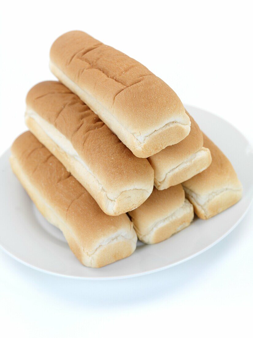 Plain hotdog buns isolated against a white background
