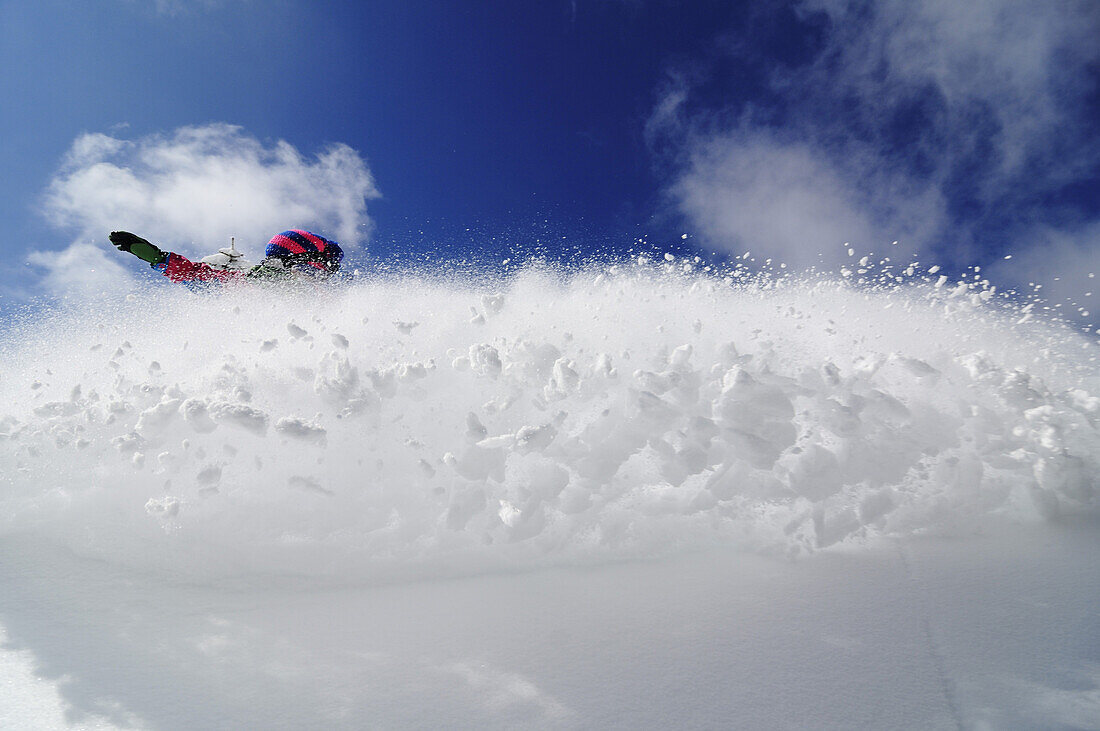 Snowboarder in the deep powder snow, Reit im Winkl, Chiemgau, Upper Bavaria, Bavaria, Germany, Europe