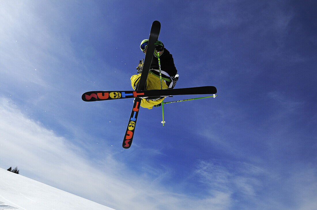 Low angle view at skier during jump, Reit im Winkl, Chiemgau, Upper Bavaria, Bavaria, Germany, Europe