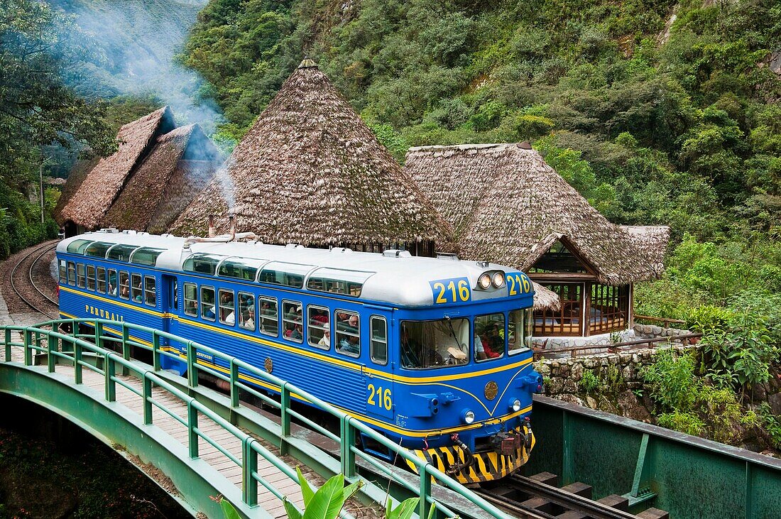 A Perurail train arriving in the town of Agua Calientes near Macchu Pichu, Peru