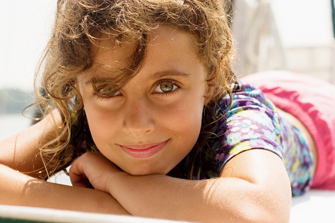 Young girl lying in the sun.