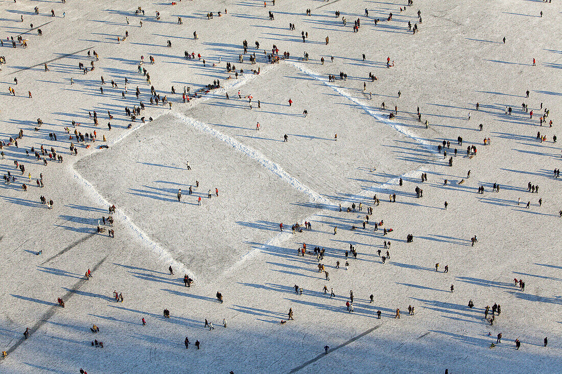 Aerial view of an ice hockey pitch and visitors on the frozen lake Maschsee in Hannover, Lower Saxony, Germany