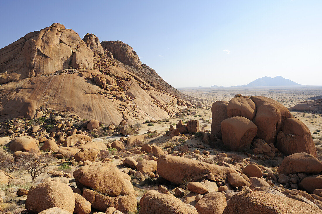 Red granite rock and balancing rock in savannah, Spitzkoppe, Namibia
