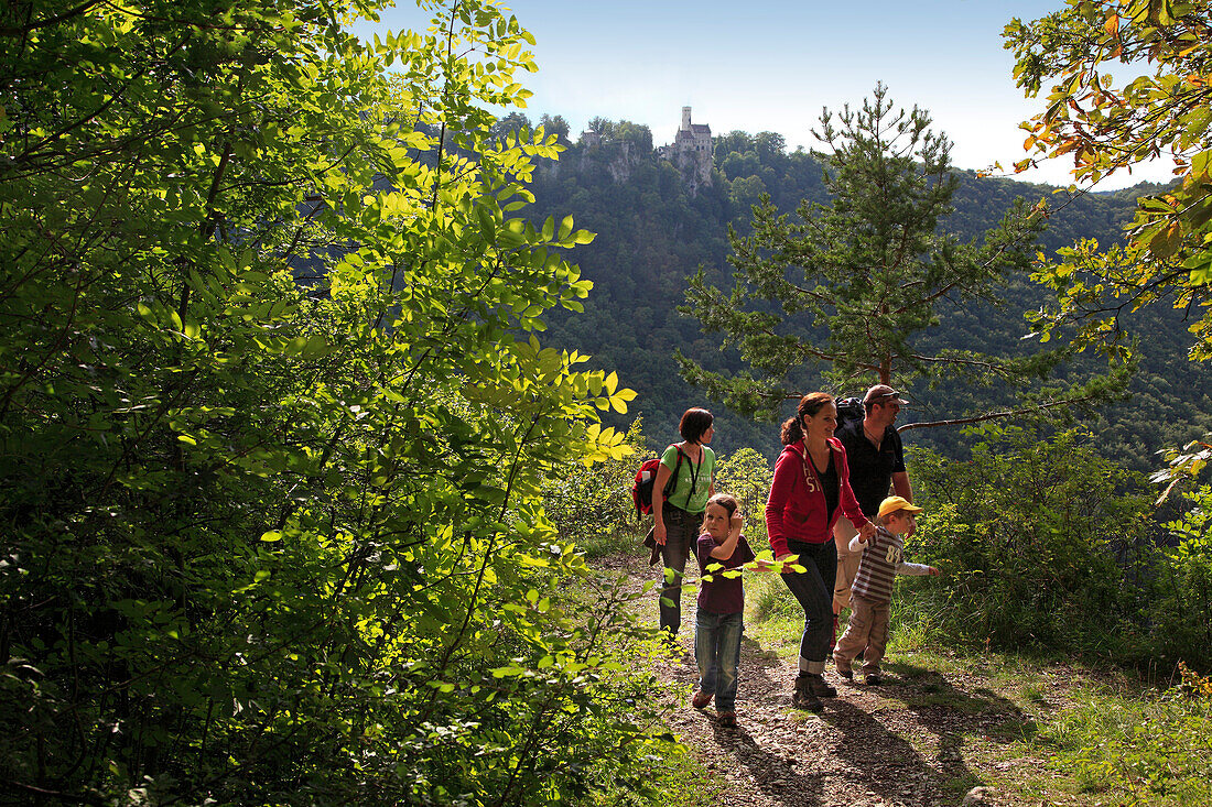 Hikers at Lichtenstein castle, Swabian Alb, Baden-Wurttemberg, Germany