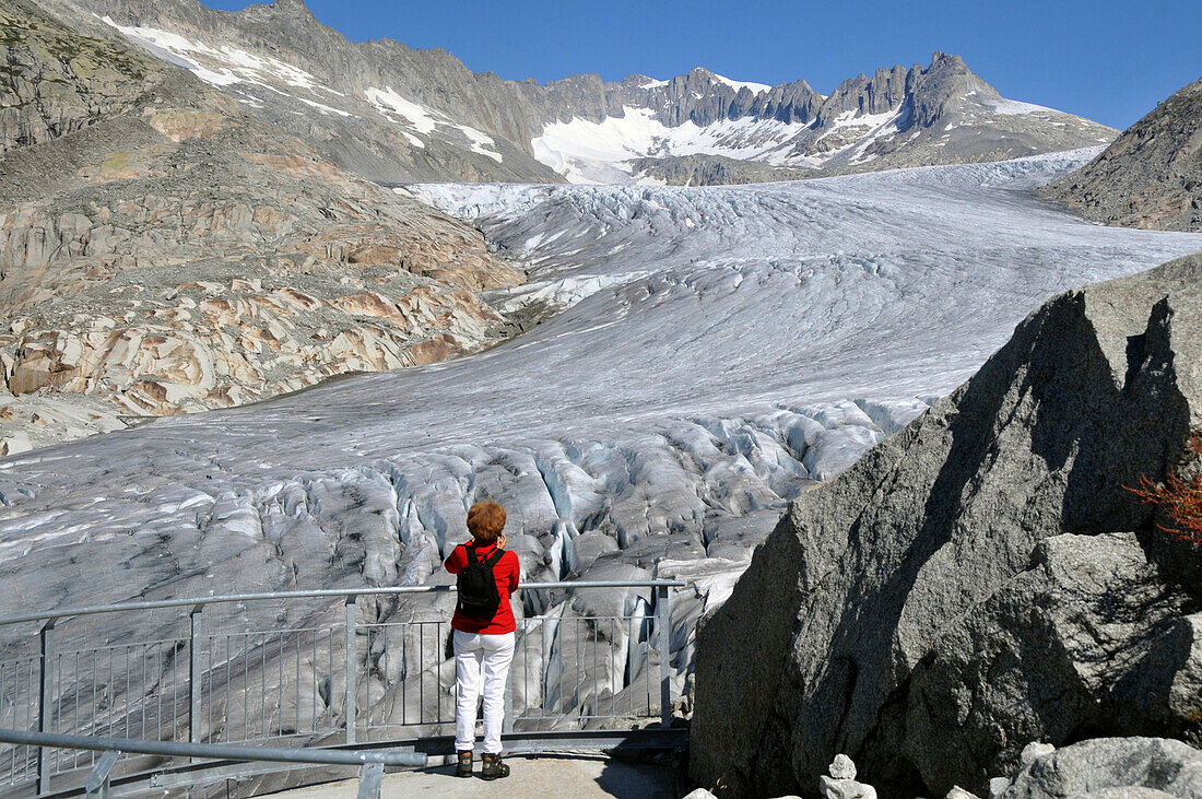 Woman visiting Rhone Glacier, Furkapass, Canton of Valais, Switzerland