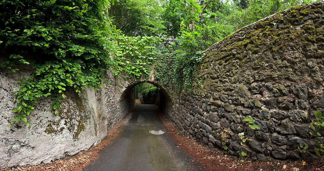 Deserted alley with tunnel, Le Puy-en-Velay, Haute Loire, Southern France, Europe