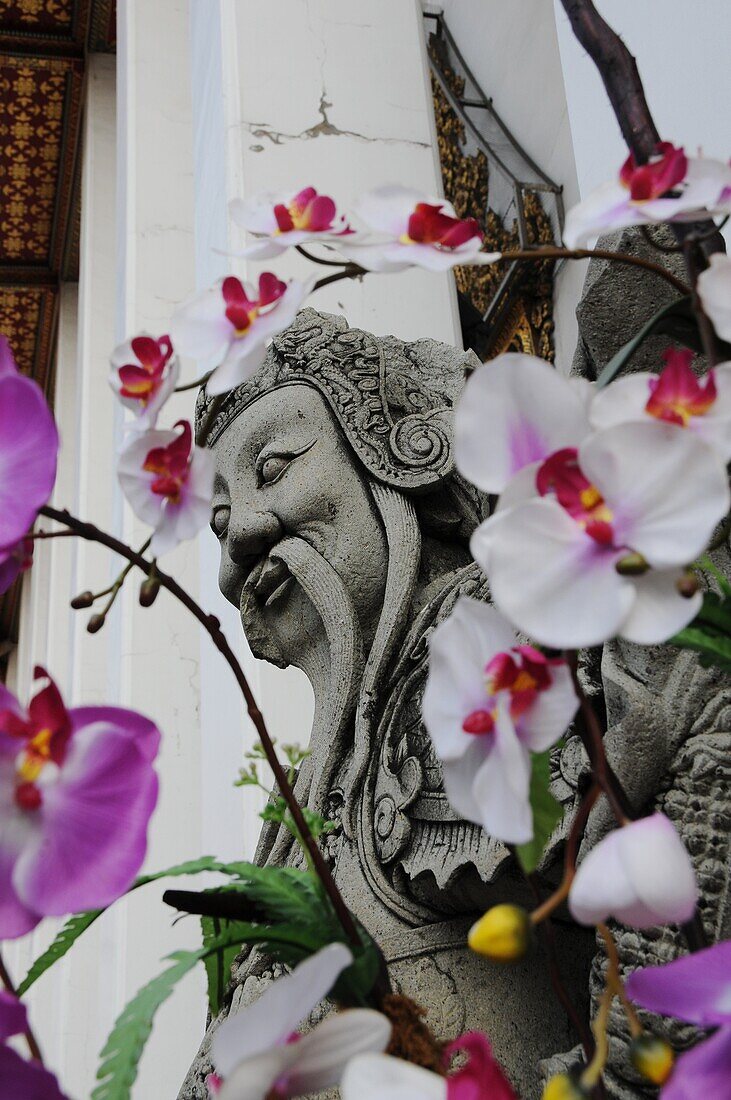 Guardian behind Flowers in Wat Pho Bangkok