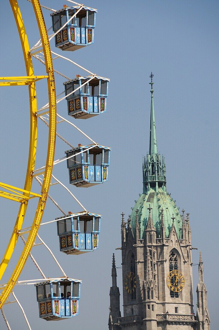 Ferris wheel infront St. Peters Church in Munich