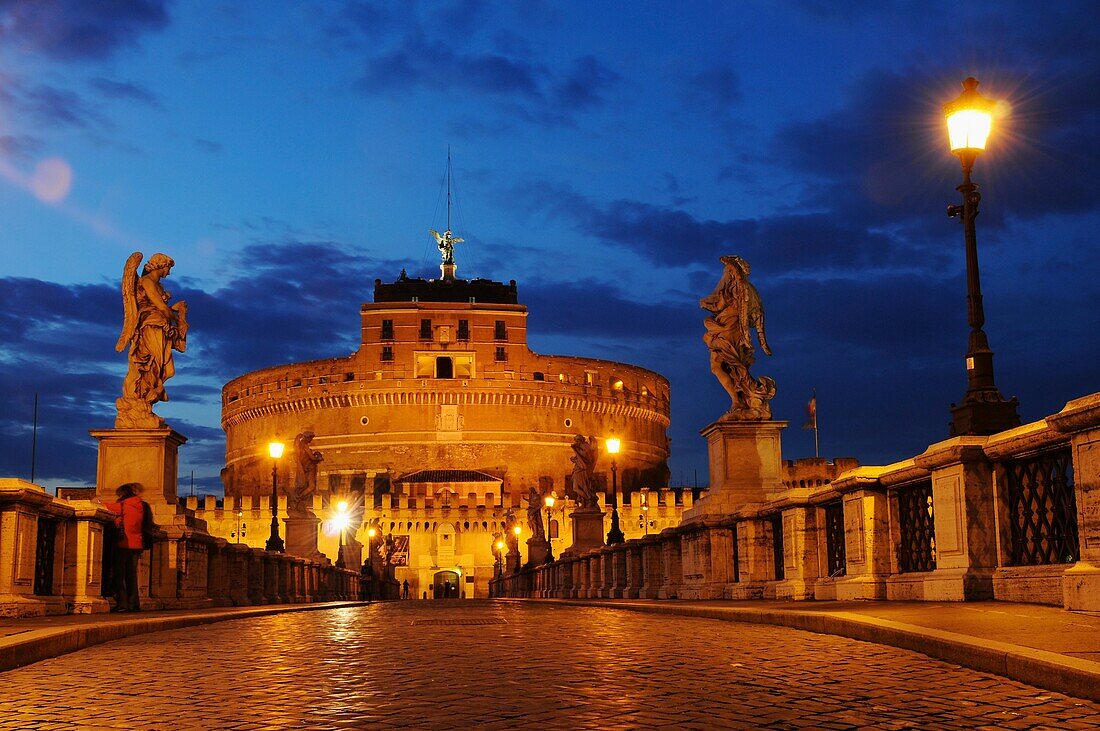 Castel Sant Angelothe Tiber River and Ponte Sant Angelo illuminated at dawn