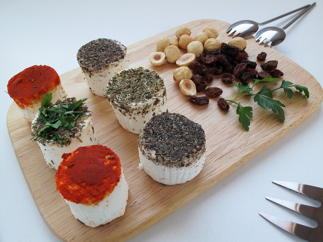 Goat cheese with red pepper, herbs, nuts and raisins