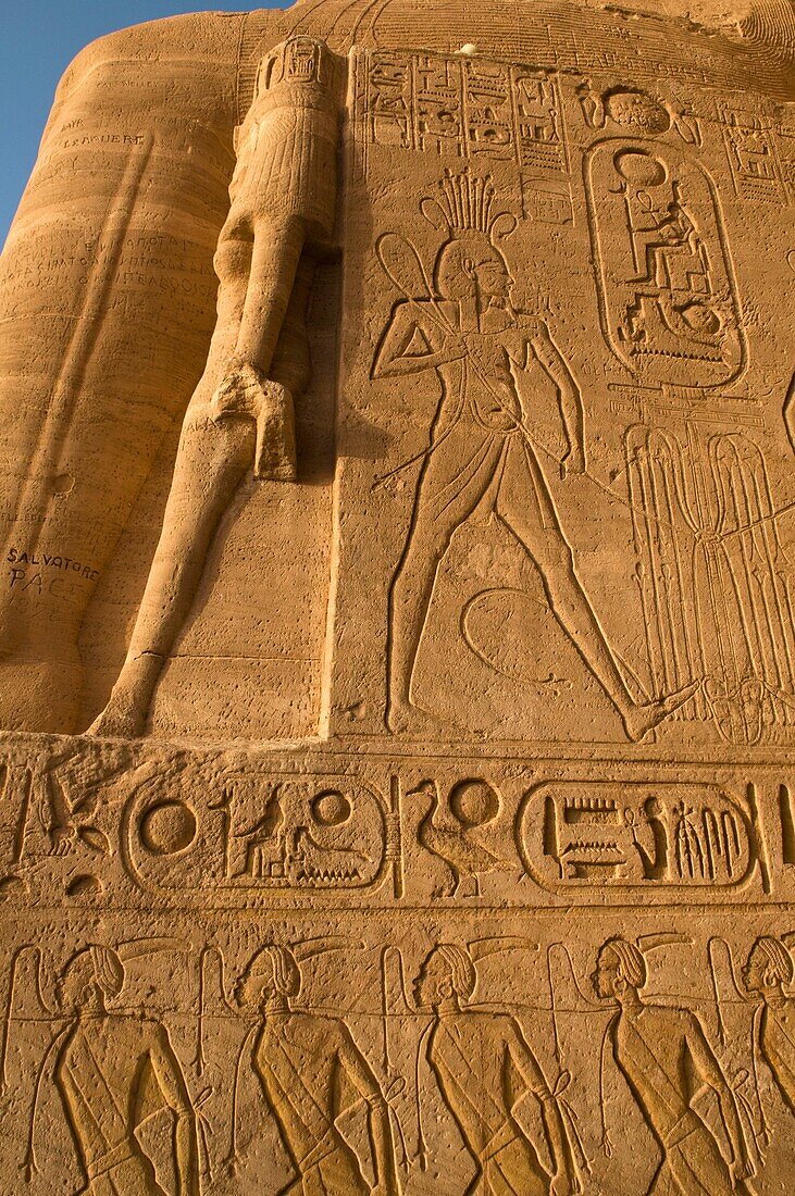 bas relief carvings on the walls of the Sun Temple at Abu Simbel in Egypt in morning sunlight