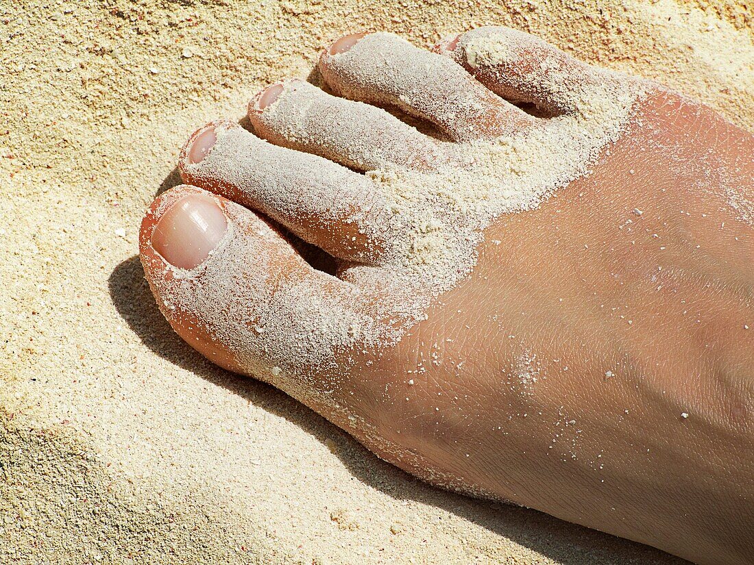 Right toes with sand Caribbean beach in Cayo Levisa Cuba.