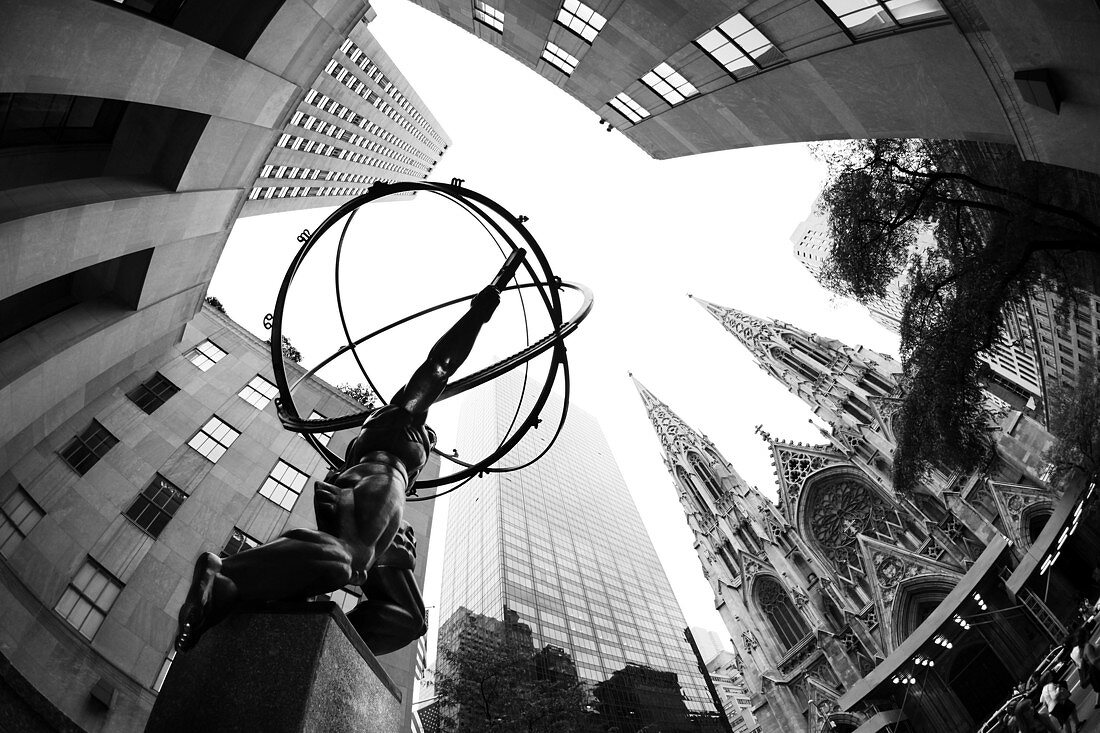 Atlas Statue of Rockefeller Center and St. Patrick's Cathedral in background. New York City. USA