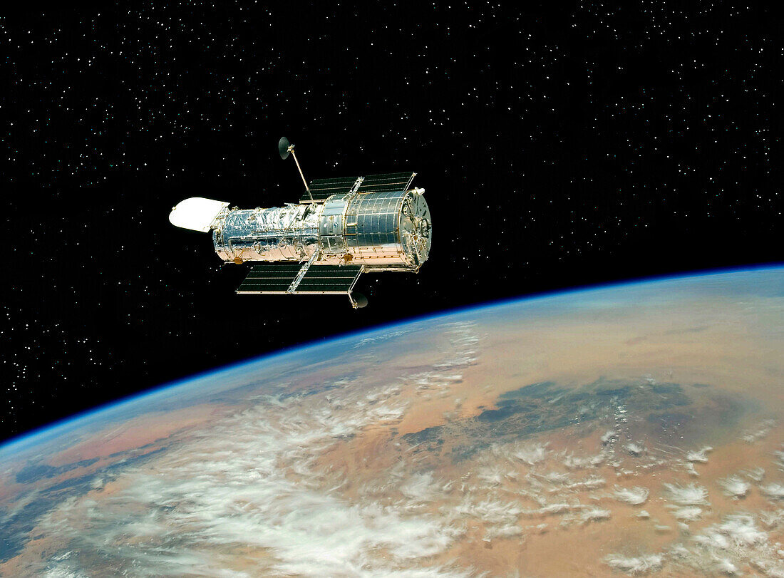 Hubble drifts over Earth after its release on May 19, 2009 by the crew of the Space Shuttle Atlantis The crew had performed all planned tasks over the course of five spacewalks, making the Servicing Mission 4, the fifth astronaut visit to the Hubble Spac