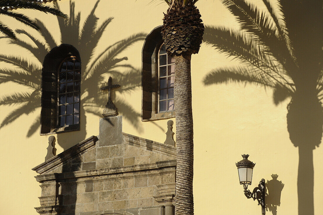 Palm trees in front of the church Nuestra Senora de los Angeles at Garachico, Northwest Tenerife, Spain