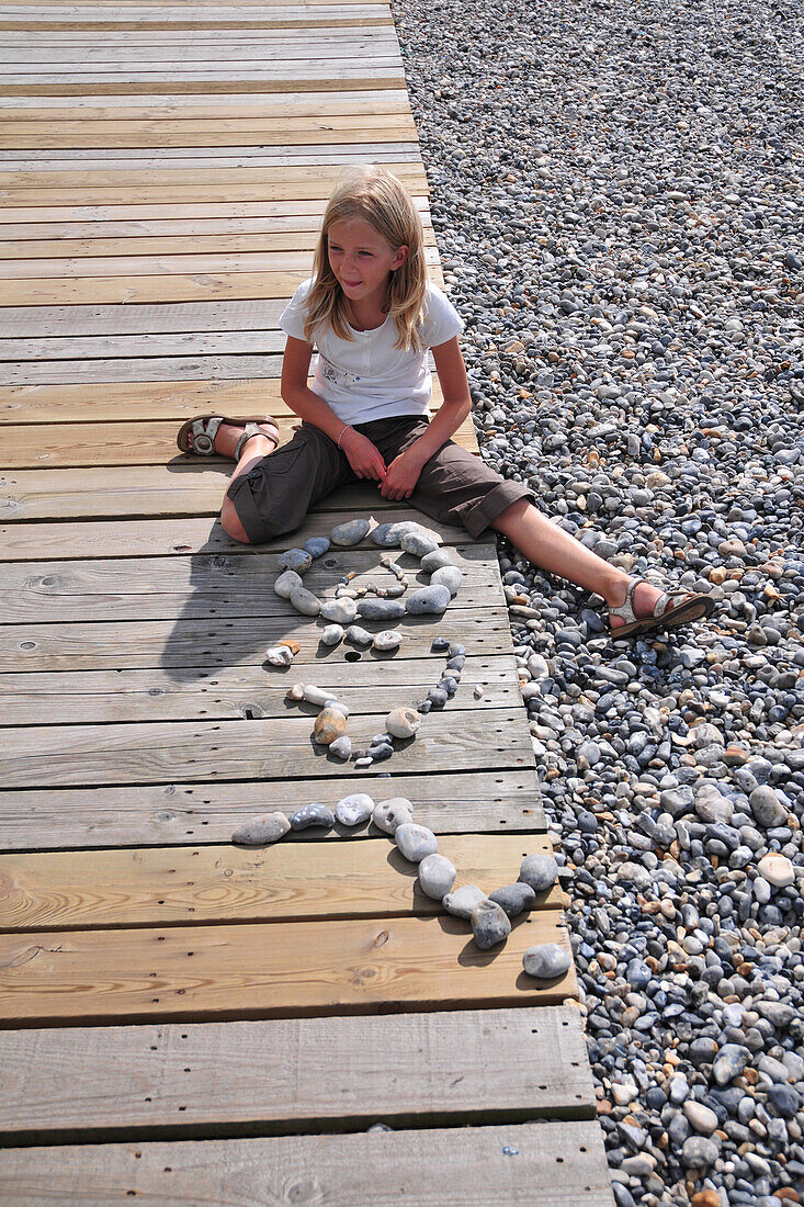 Little Girl Playing With Pebbles, Somme (80), Picardy, France