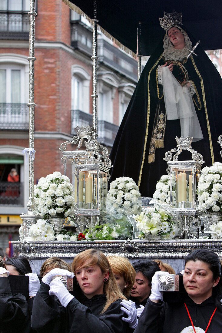 Women With An Air Of Sorrow And Reverence Carrying The Statue Of Virgin Mary On A Shield Decorated With Flowers, Procession Of The Brotherhood Of Silence (Confradia Del Silencio) Of The Parish Of The Holy Christ Of Faith Church, Madrid, Spain