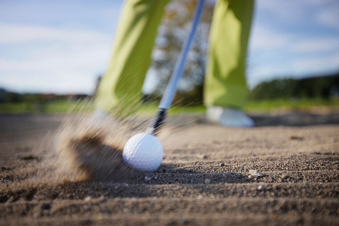 Man playing golf, Prien am Chiemsee, Bavaria, Germany