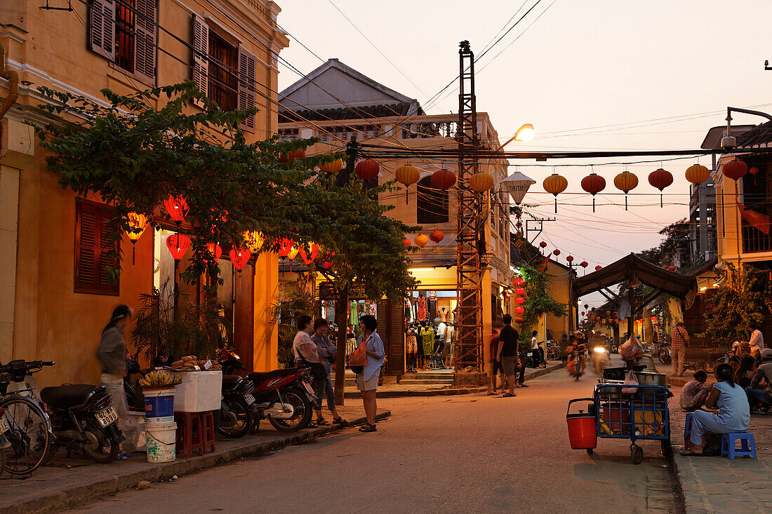 Street scenery with cookshop in the evening, Hoi An, Annam, Vietnam