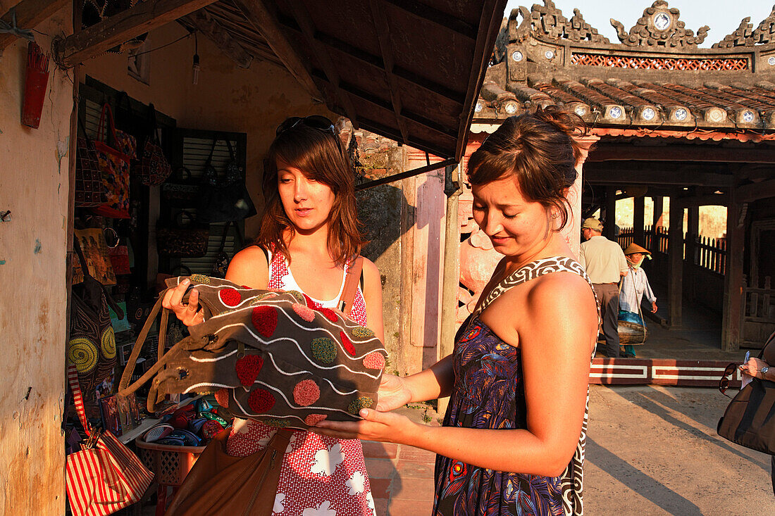 Two women shopping, Chua Cau, Japanese Bridge, Hoi An, Annam, Vietnam