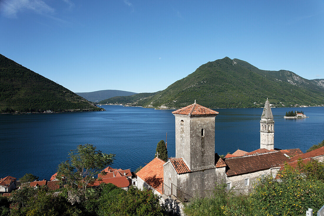 View of Sveti Nikola church with bell tower, in the background Gospa od Skrpjela island, Perast, Bay of Kotor, Montenegro, Europe