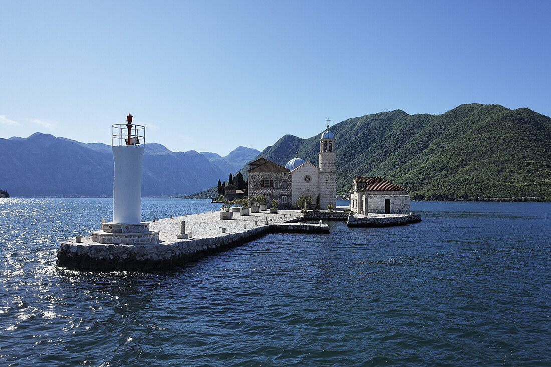 Church on the Island of Gospa od Skrpjela in the sunlight, Perast, Bay of Kotor, Montenegro, Europe