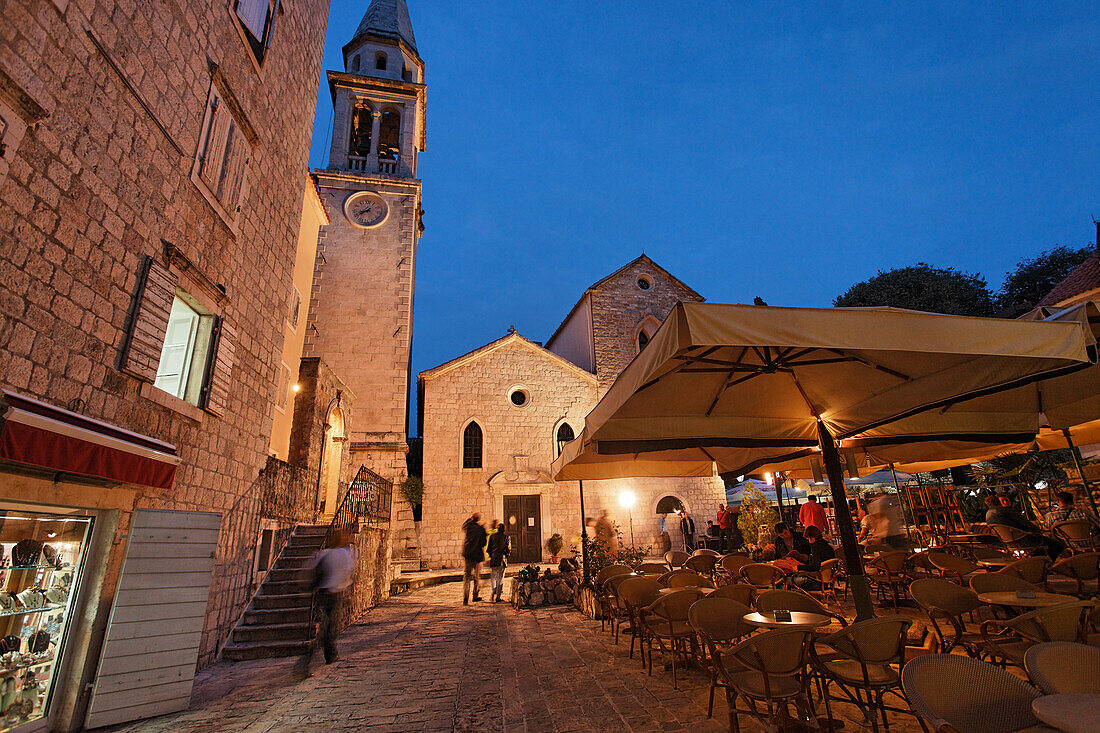 Restaurant in front of Sveti Ivana cathedral in the evening, Budva, Montenegro, Europe