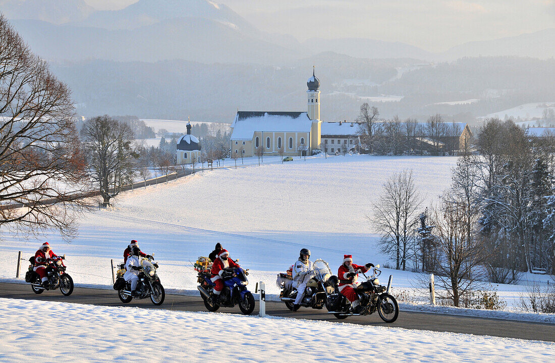 Motorcycle club at the church of the holy Marinus and Anian in Wilparting near Irschenberg, Winter in Bavaria, Germany, Europe
