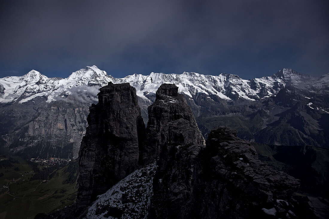 Person walking a highline between two rocks, Schilthorn, Bernese Oberland, Canton of Bern, Switzerland