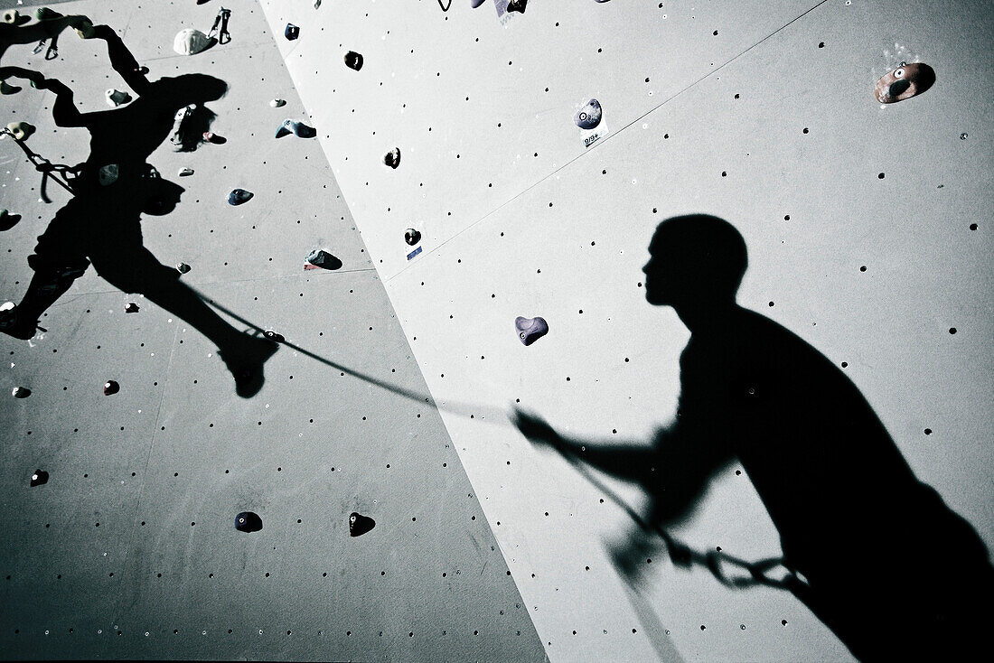 Shadows of two climbers on a climbing wall, Kaufbeuren, Bavaria, Germany