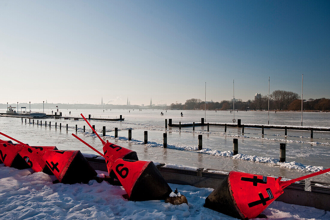 Buoys in front of frozen Aussenalster, winter impressions, Hamburg, Germany, Europe