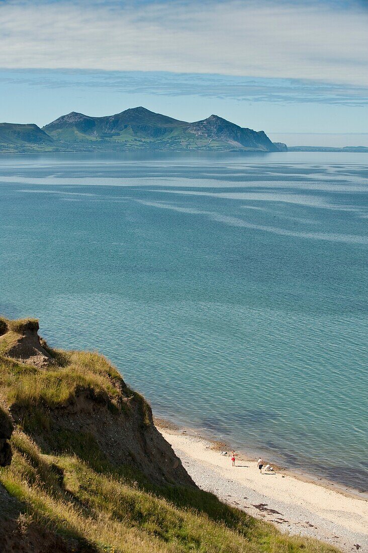 Looking towards Yr Eifl - The Rivals mountains, Summer morning, Dinas Dinlle beach on the north coast of the Lleyn Peninsula, Wales UK