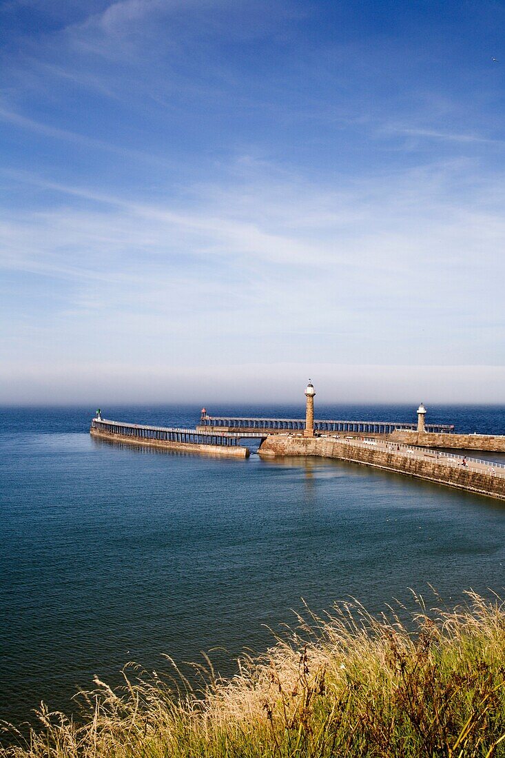 West and East Piers with a Sea Mist Looming Whitby North yorkshire England