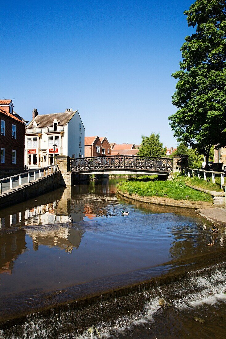 Weir and bridges over the River Leven Stokesley Yorkshire England