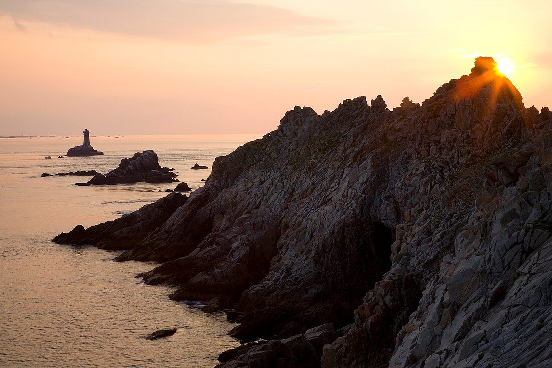 SUNSET AT POINTE DU RAZ. FINISTERE. SOUTH BRITTANY. FRANCE