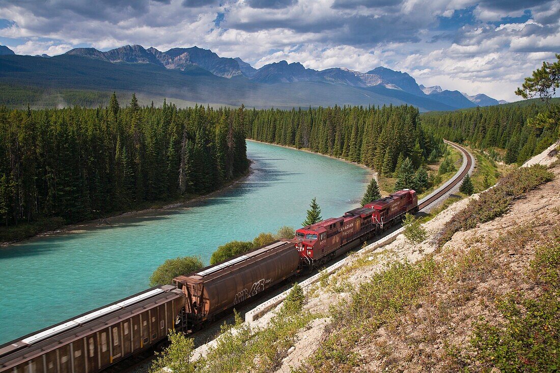 Alberta, Banff National Park, Bow River, Canada, Canadian Pacific Railway, Canadian rocky mountains, freightliner, freight-train, Goods train, holiday, horizontal, locomotive, mountain, muleshoe, north america, northern America, railroad, red, river, stre