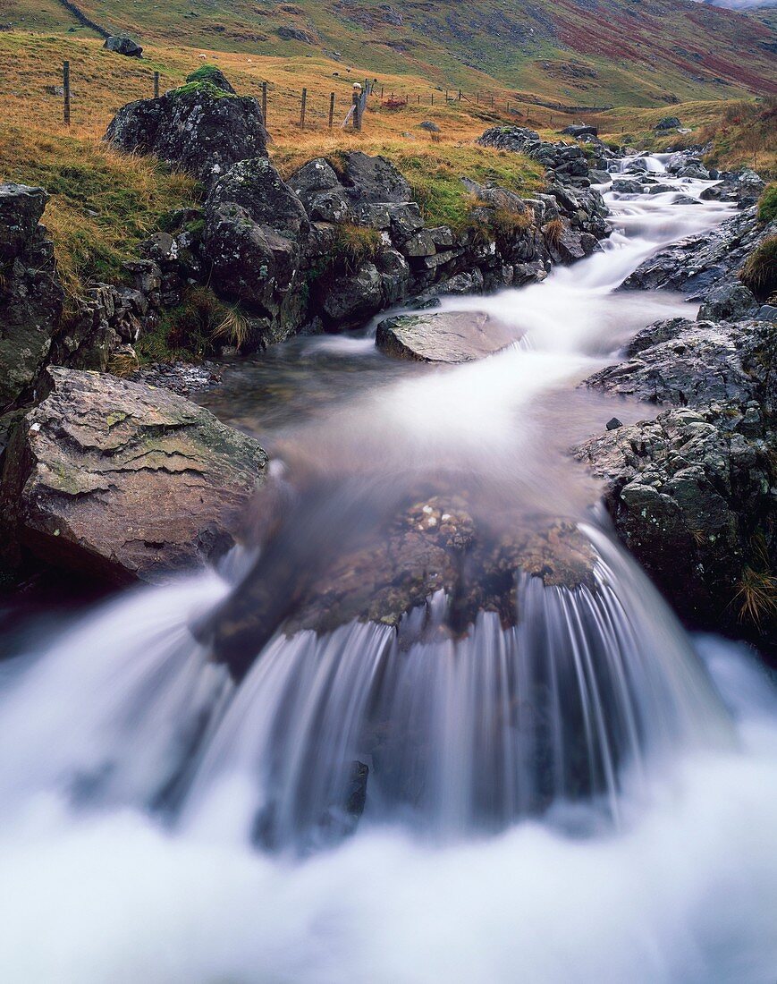 Small waterfall on Hause Gill at Honnister Pass near Seatoller in the Lake District National Park, Cumbria, England, United Kingdom