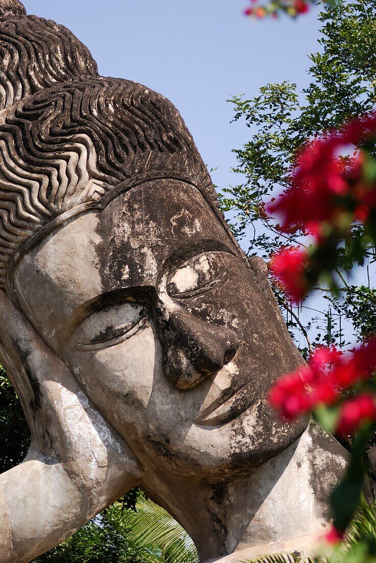 Close up of the Large Reclining Buddha at the Buddha Park at Xieng Khuan, Vientiane, Laos, South East Asia