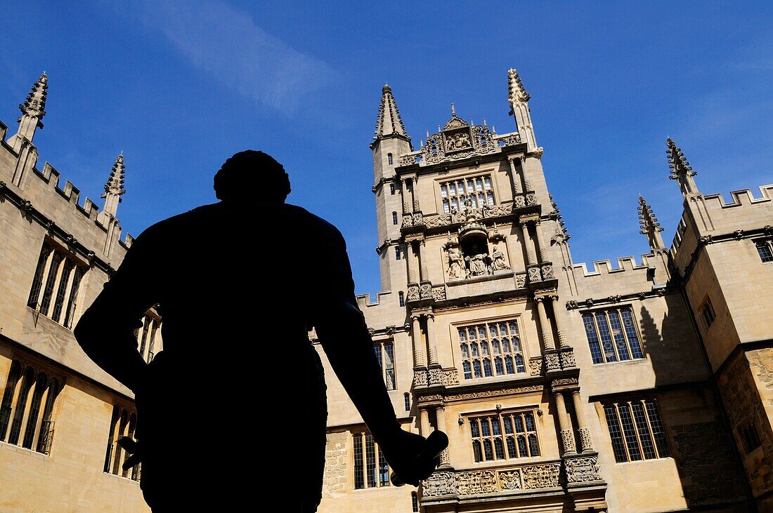 The Old Bodleian Library, with Silhouetted Statue of the Earl of Pembroke, Oxford, England, UK