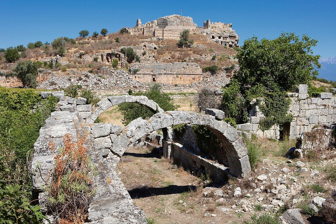 Ruins of a market hall with Acropolis Hill at the backgroung Tlos, South West Turkey
