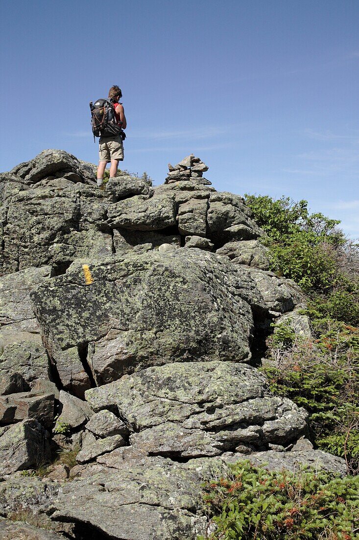 Hiker on Caps Ridge Trail in the White Mountains, New Hampshire USA