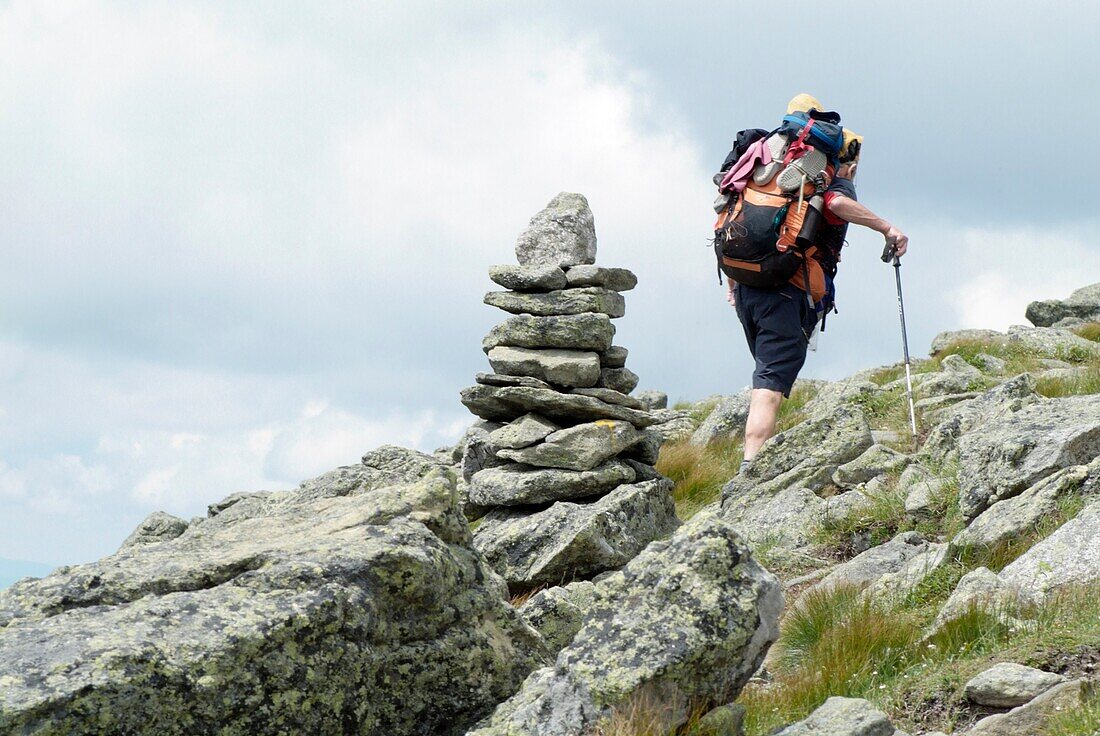 Appalachian Trail- A thru-hiker makes his way to the summit of Mount Clay during the summer months in the scenic landscape of the White Mountains, New Hampshire USA Notes:
