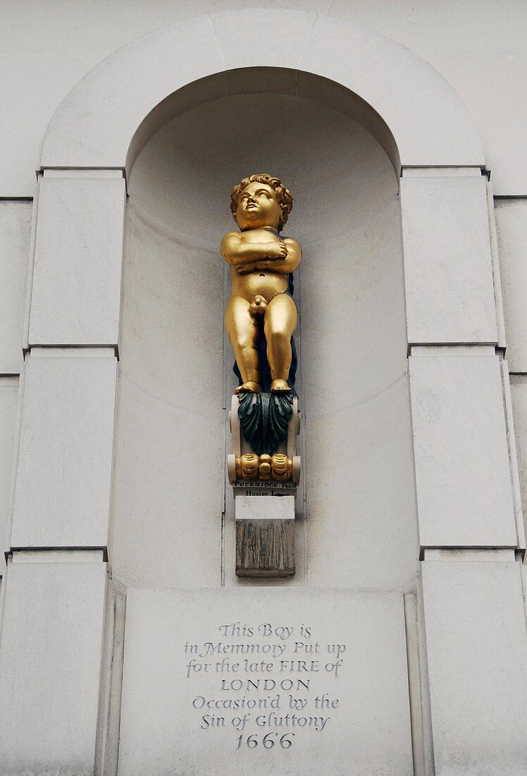Statue of boy commemorating the Great Fire of London in West Smithfield, London, England
