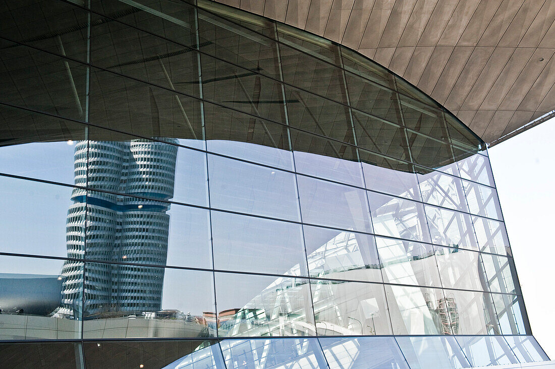 Exterior of a building with a reflection of BMW Welt on it, Olympic Park, Munich, Upper Bavaria, Bavaria, Germany