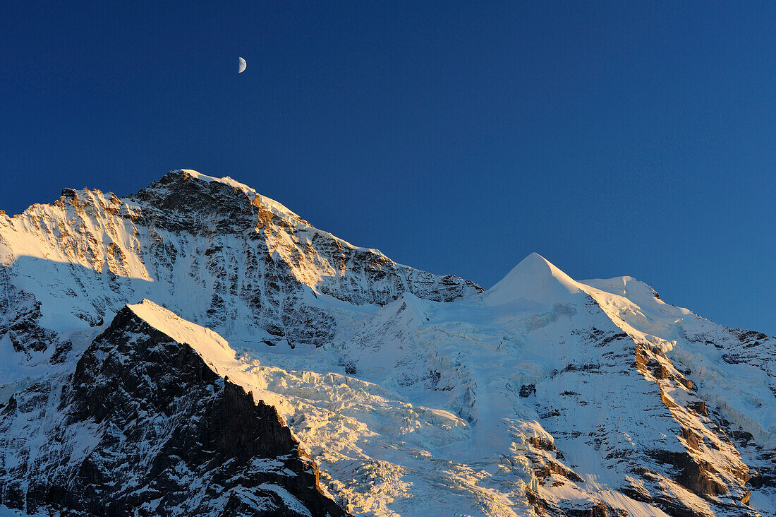 Jungfrau and Silberhorn with half moon, Kleine Scheidegg, Grindelwald, UNESCO World Heritage Site Swiss Alps Jungfrau - Aletsch, Bernese Oberland, Bern, Switzerland, Europe