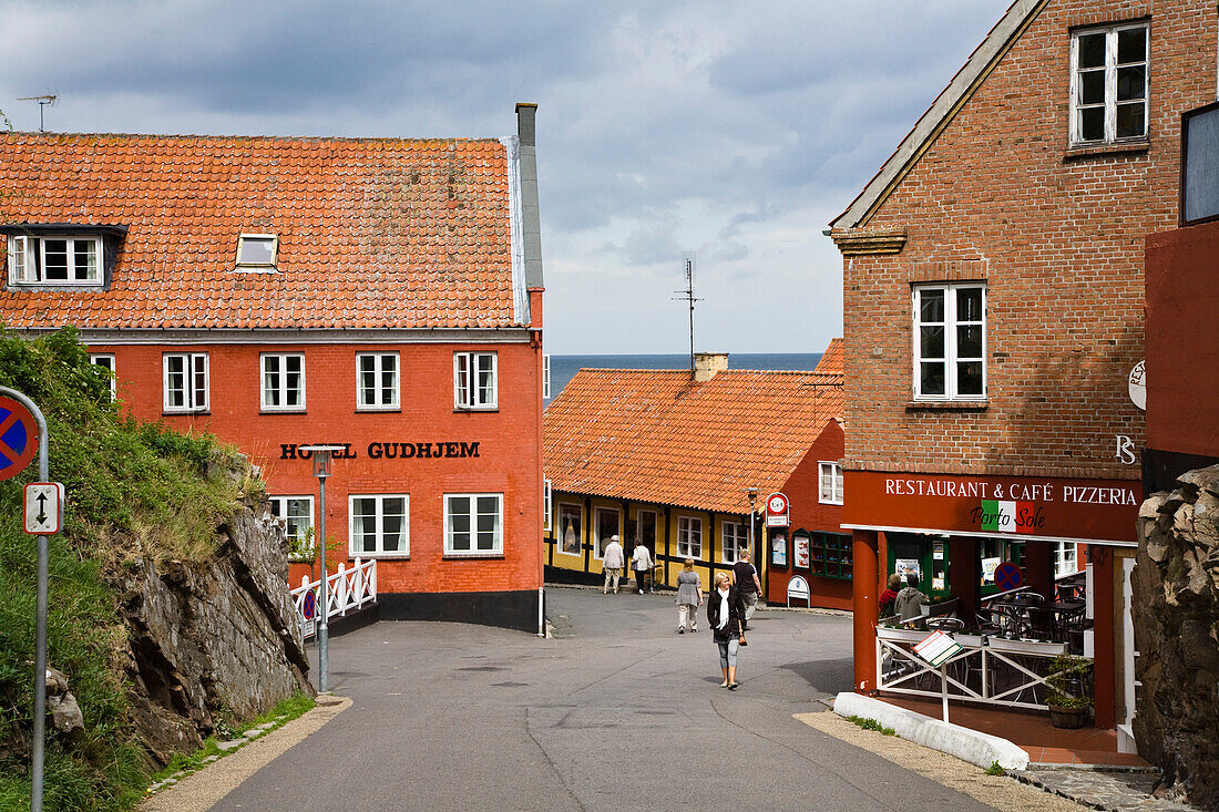 People in the streets of Gudhjem village, Bornholm, Denmark, Europe