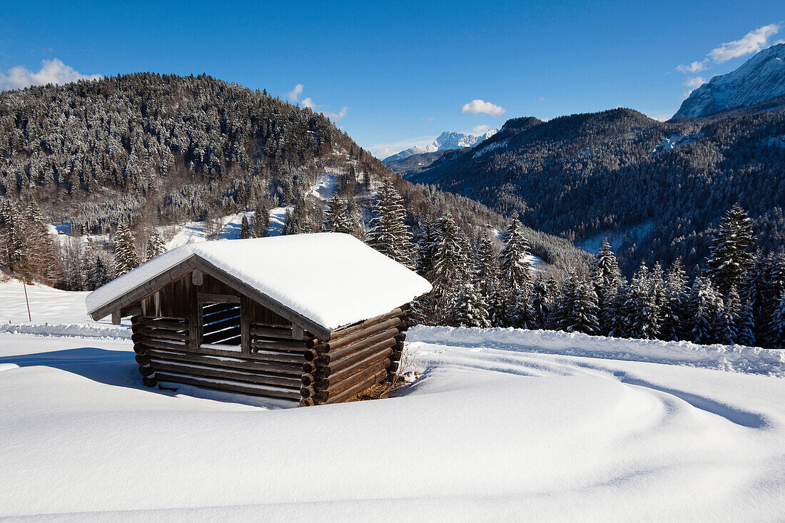 Mountain scenery with hay barn in winter, Upper Bavaria, Germany, Europe