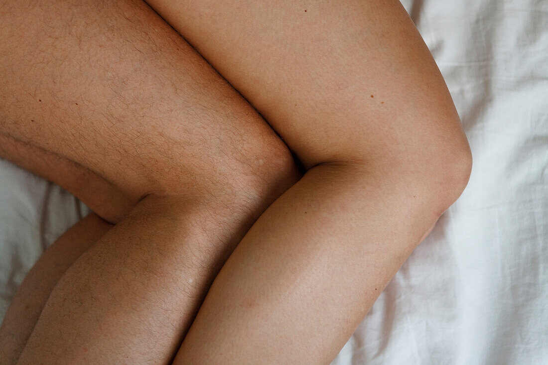 Man and woman side by side in bed