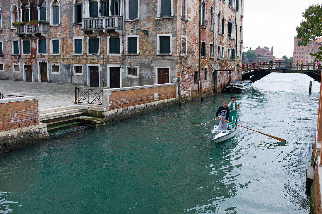 Racing gondola with two gondoliers on a channel, Venice, Veneto, Italy, Europe