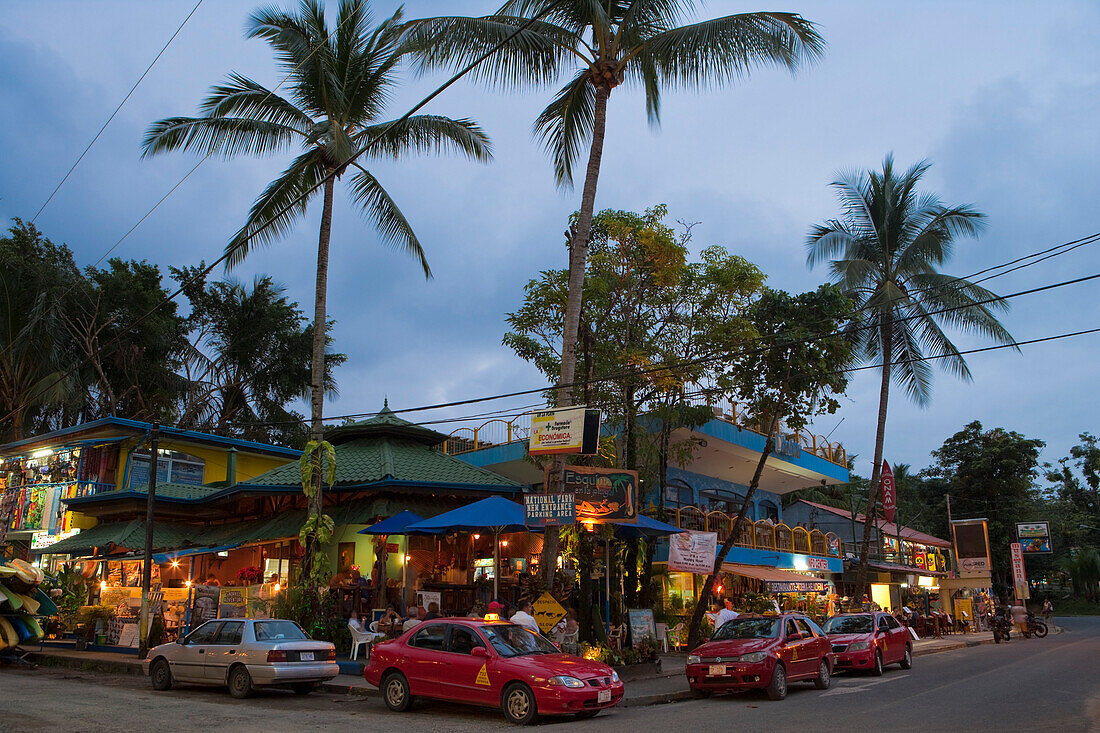 Taxis outside bars and restaurants at dusk, Manuel Antonio, Puntarenas, Costa Rica, Central America, America